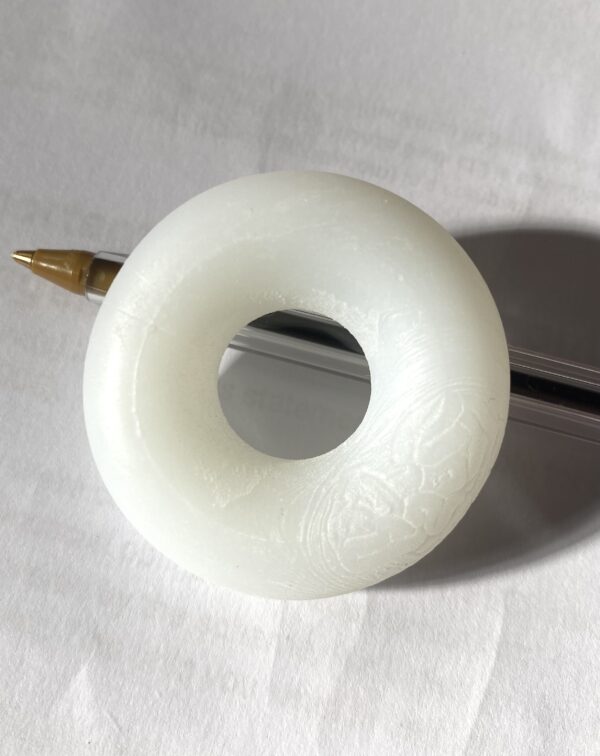 Cock ring with ballpoint pen for scale